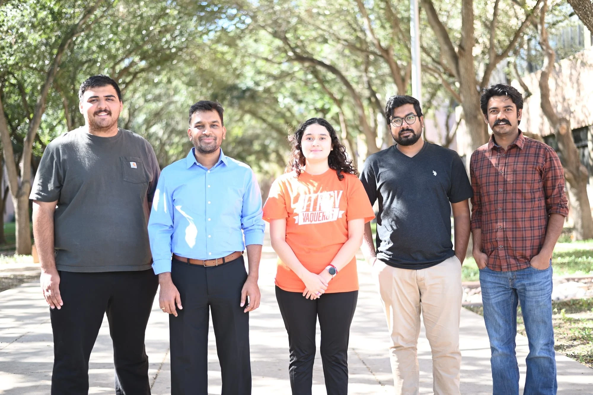 Members of the Yemmireddy Lab standing together on the UTRGV campus