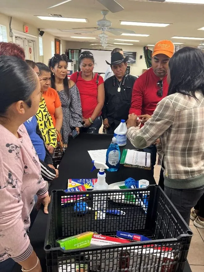 Participants gathered around a hands-on food safety activity