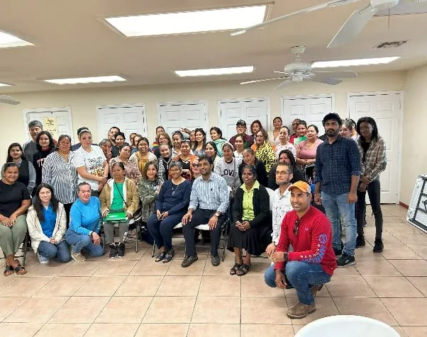 A large group photo of training participants